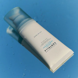 SKIN 1004 Madagascar Centella Hyalu-Cica Water-Fit Sun Serum tube on a blue surface