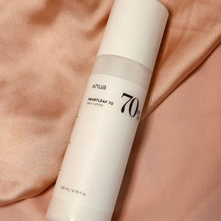 Anua Heartleaf 70% Daily Relief Lotion on a silk surface