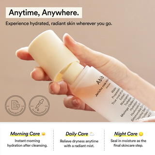 a hand opening Abib Jericho Rose Mist Serum Glow Spray bottle