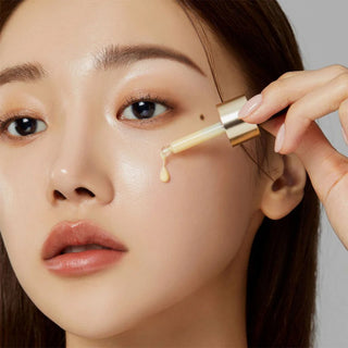 woman applying medicube Deep Vita C Ampoule on her cheek