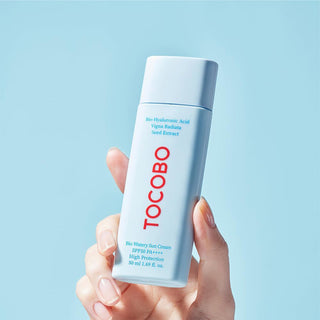 hand holding TOCOBO Bio Watery Sun Cream SPF50+ PA++++