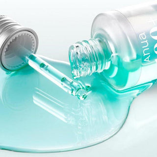 Anua 100+ PDRN + Hyaluron Serum  bottle with product dispensed on the surface
