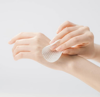 Anua Birch Moisture Boosting Pad being applied on hand