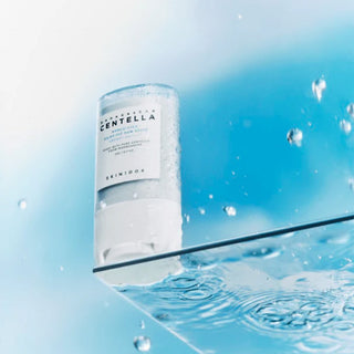 SKIN1004 Hyalu-Cica Silky-Fit Sun Stick on a glass surface