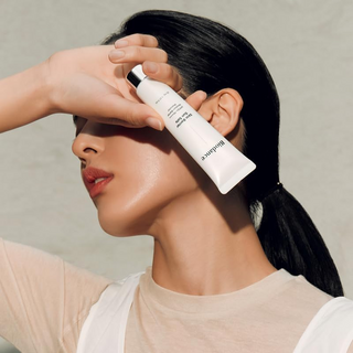 woman covering her face with BIODANCE Sun Safe Skin Barrier SPF50+ PA++++ 30 mL