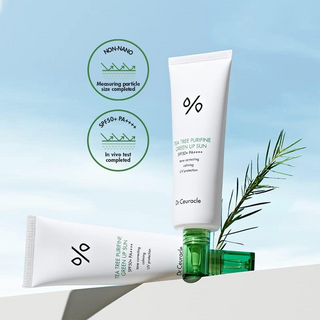 two Dr.Ceuracle Tea Tree Purifine Green Up Sun SPF50+ products with a leaf in the background