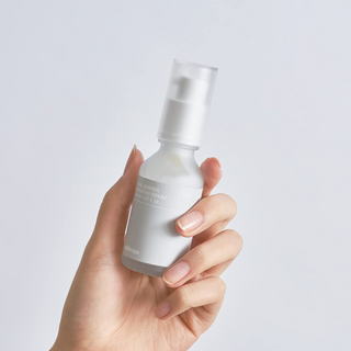 a hand holding celimax Dual Barrier Skin Boosting Serum 30mL