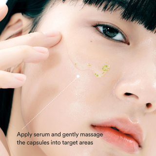 close-up of a woman applying Abib Heartleaf Teca Capsule Serum on her cheek