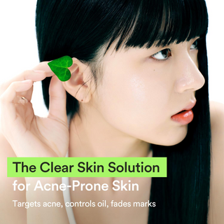 woman tucking a leaf behind her ear