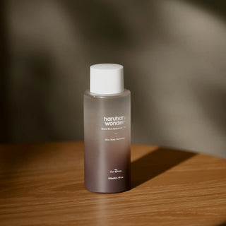haruharu wonder Black Rice Hyaluronic Toner bottle on a wooden surface