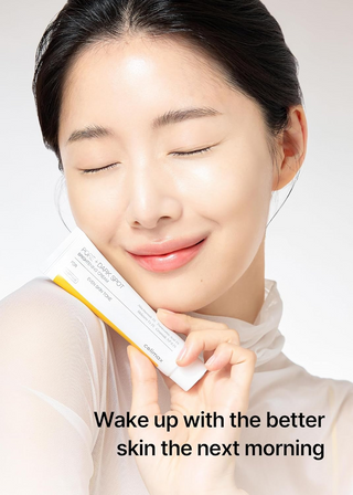 woman holding celimax Pore+Dark Spot Brightening Cream 35mL and smiling