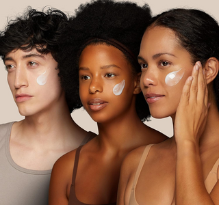 3 women of different skin tones with product swatch on their cheeks