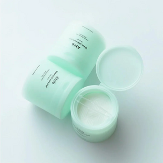 three jars of Abib Green LHA Pore Pad Clear Touch with mini tong
