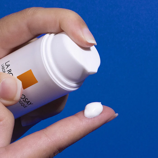 LA ROCHE-POSAY Anthelios Age-Correct SPF50+ 50mL pumped out on finger