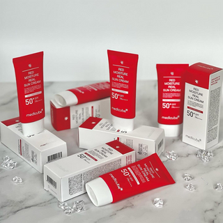 multiple medicube Red Moisture Real Sun Cream tubes with box packaging
