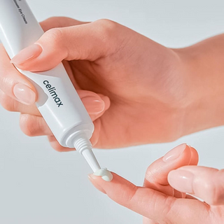 celimax Noni Ultimate Eye Cream dispensed out on a finger