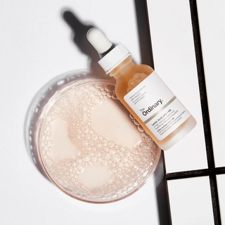 The Ordinary Lactic Acid 10% + HA Serum bottle with product in container