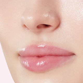 close-up of a woman lips with Medicube PDRN Peptide Glossy Lip Balm on it.