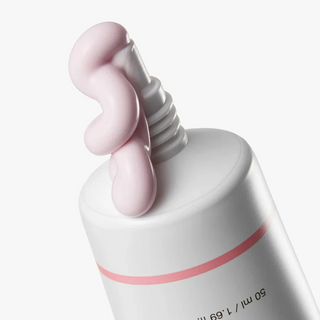 close-up of medicube PDRN Pink Tone Up Sun Cream dispensed out