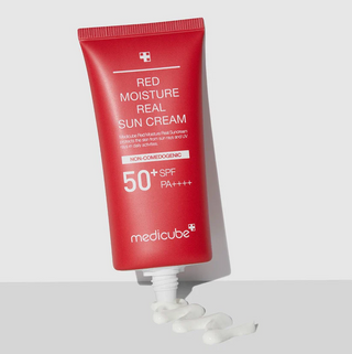 open tube of medicube Red Moisture Real Sun Cream with product dispended out