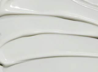 close-up of medicube Red Moisture Real Sun Cream product swatch