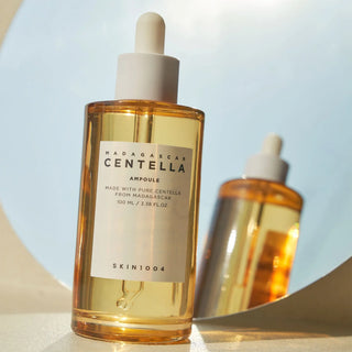 Centella Ampoule bottle with mirror on the background