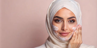woman applying cleanser on her face