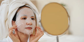 woman with a sheet mask on her face