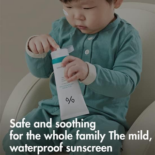 child holding Dr.Ceuracle Cica Regen Waterproof Sun SPF50+ PA++++ tube